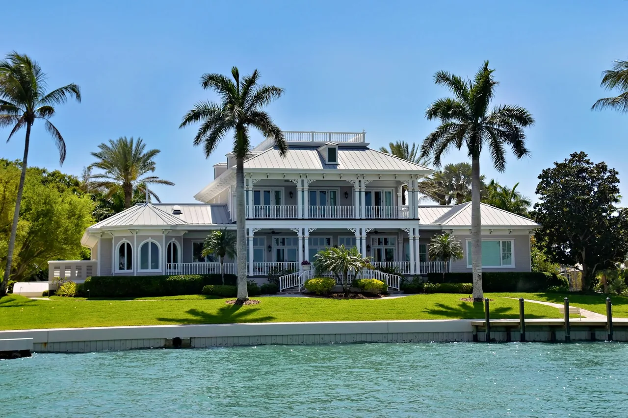 Waterfront home with palm trees in Sarasota, Florida